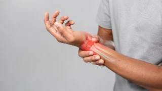 Man Suffering From Acute Wrist Fracture And Joint Pain - Orthopedic Stock Photo