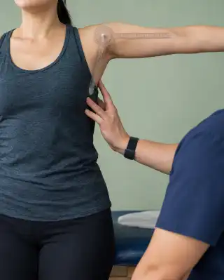 Shoulder Motion Test with Goniometer by Physical Therapist - Stock Photo