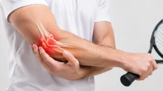 Tennis Elbow Pain and Joint Inflammation in Male Athlete Stock Photo