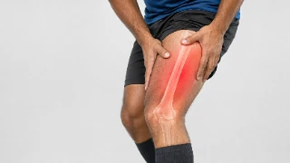 Athlete Experiencing Severe Thigh Pain with Femur Bone Graphic Overlay