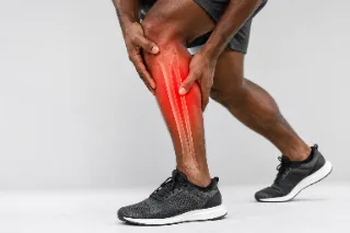 Male Athlete Experiencing Severe Lower Leg Tibia and Fibula Injury - Orthopedic Medical Photo