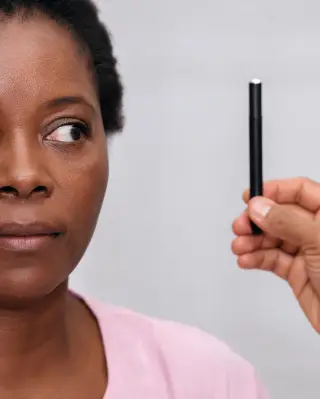 Neurological Eye Movement Test with Penlight - Clinical Exam Photo
