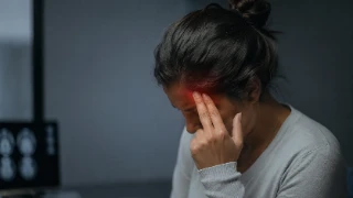 Woman Suffering From Severe Migraine Pain And Headaches - Neurology Stock Photo