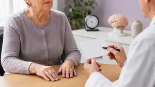 Elderly Patient During Memory Complaint Consultation with Neurologist Stock Photo