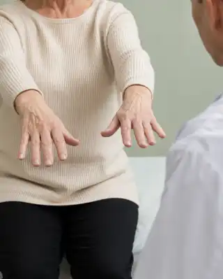 Neurological Tremor Examination of Elderly Patient Hands - Clinical Stock Photo
