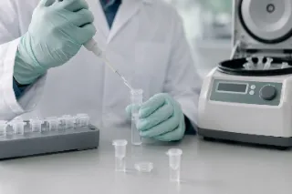 Scientist Performing DNA Extraction in Laboratory Stock Photo