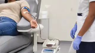Patient Donating Blood at Clinic - Medical Blood Collection Stock Photo